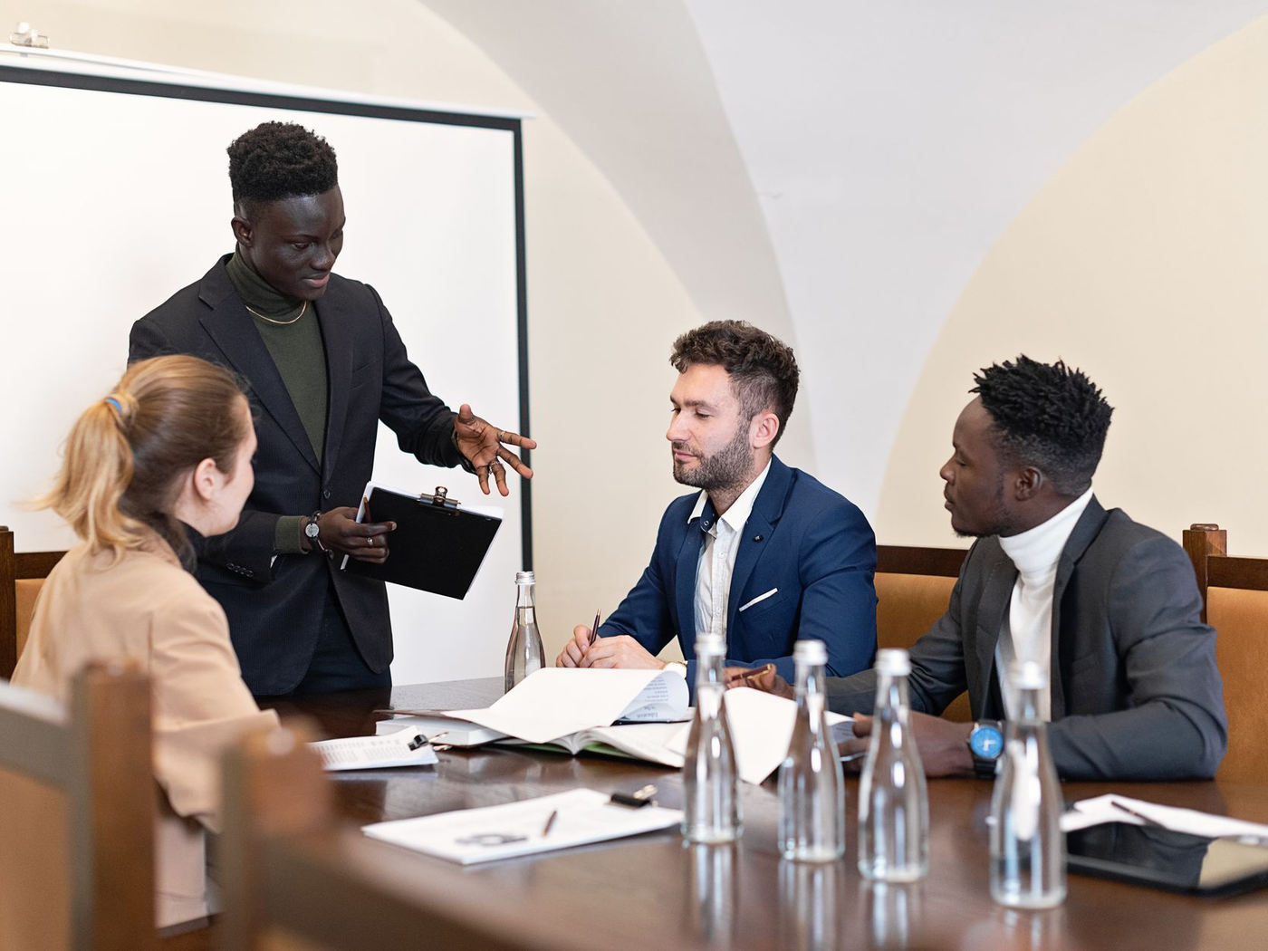 Daytime team building rotation at small entertainment tables in a function room